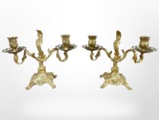 A pair of 19th century Rococo Revival gilt metal candlesticks, height 19cm.