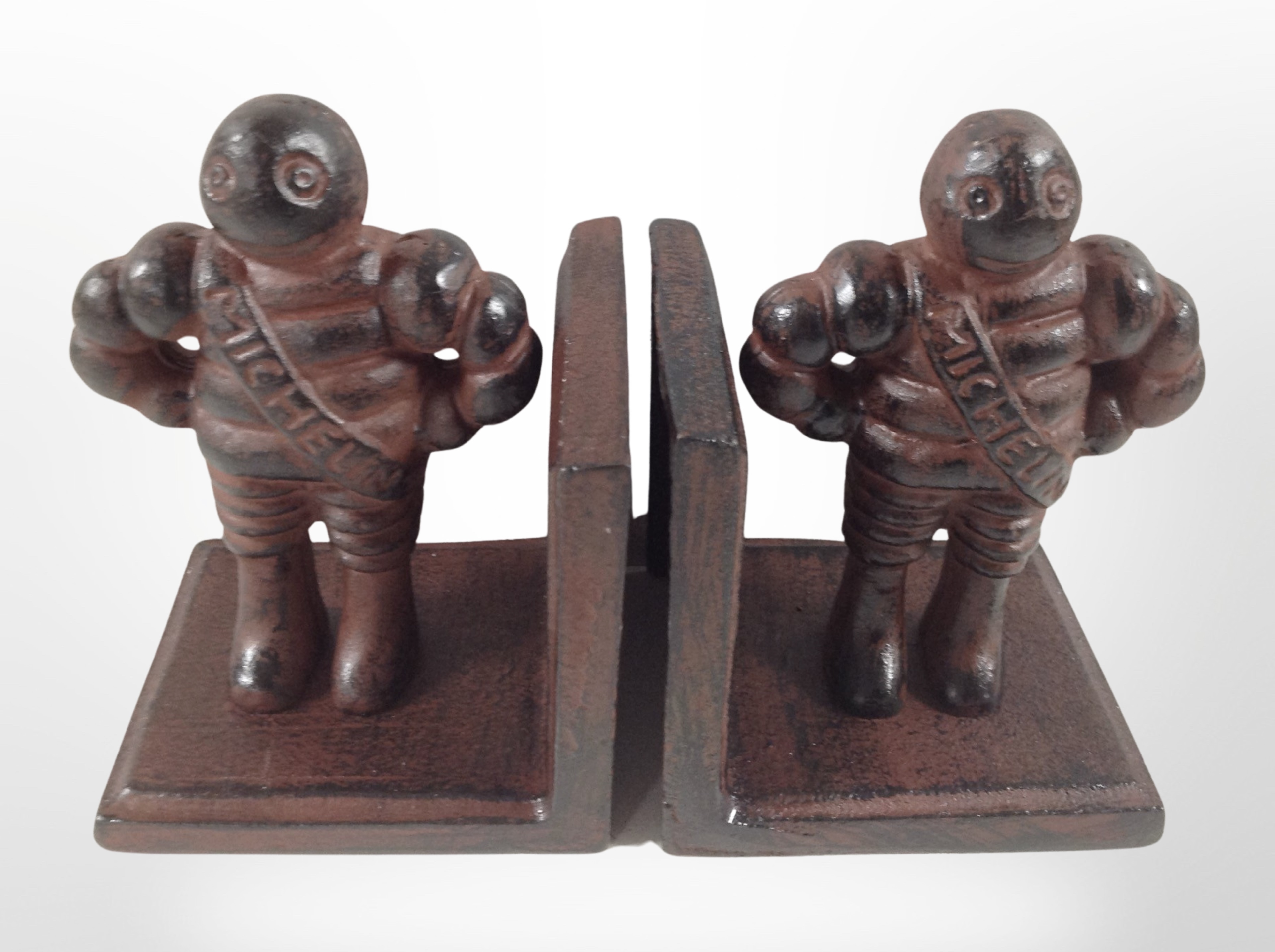 A pair of cast-iron Michelin Man bookends, height 13cm.