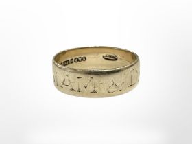 A 9ct gold band ring with inscription CONDITION REPORT: 2.