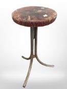 A 20th century industrial circular stool on chrome support