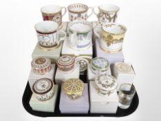 A group of boxed Royal Collection porcelain mugs and circular trinket boxes.