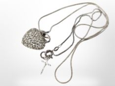 A silver snake chain with encrusted heart pendant, and a further silver box-link bracelet.