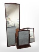 Three reproduction mahogany mirrors, largest 135cm x 43cm.