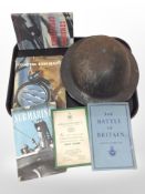 A British military tin helmet and a small quantity of military books concerning the Battle of