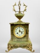 A 19th century onyx and gilt metal mounted eight day mantel clock, striking on a gong,