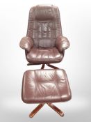 A stained beech and burgandy leather swivel armchair and footstool