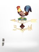 A painted cast-iron cockerel weather vane.