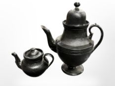 A 19th-century black ceramic coffee pot and teapot, tallest 26cm.