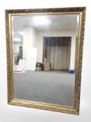 A Victorian-style gilt overmantel mirror, 112cm x 88cm.