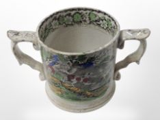 A Victorian Staffordshire twin-handled loving cup depicting a hunting scene, height 10.5cm.