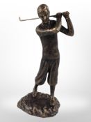 A cast-iron figure of a golfer, height 29cm.