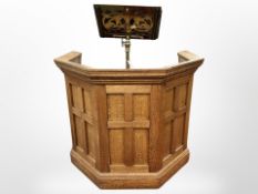 A Victorian paneled oak church lectern, with brass reading stand and bible,
