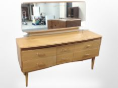 A Lebus oak mirror backed dressing table fitted six drawers,