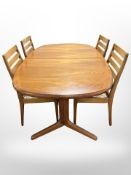 A 20th century teak extending dining table,