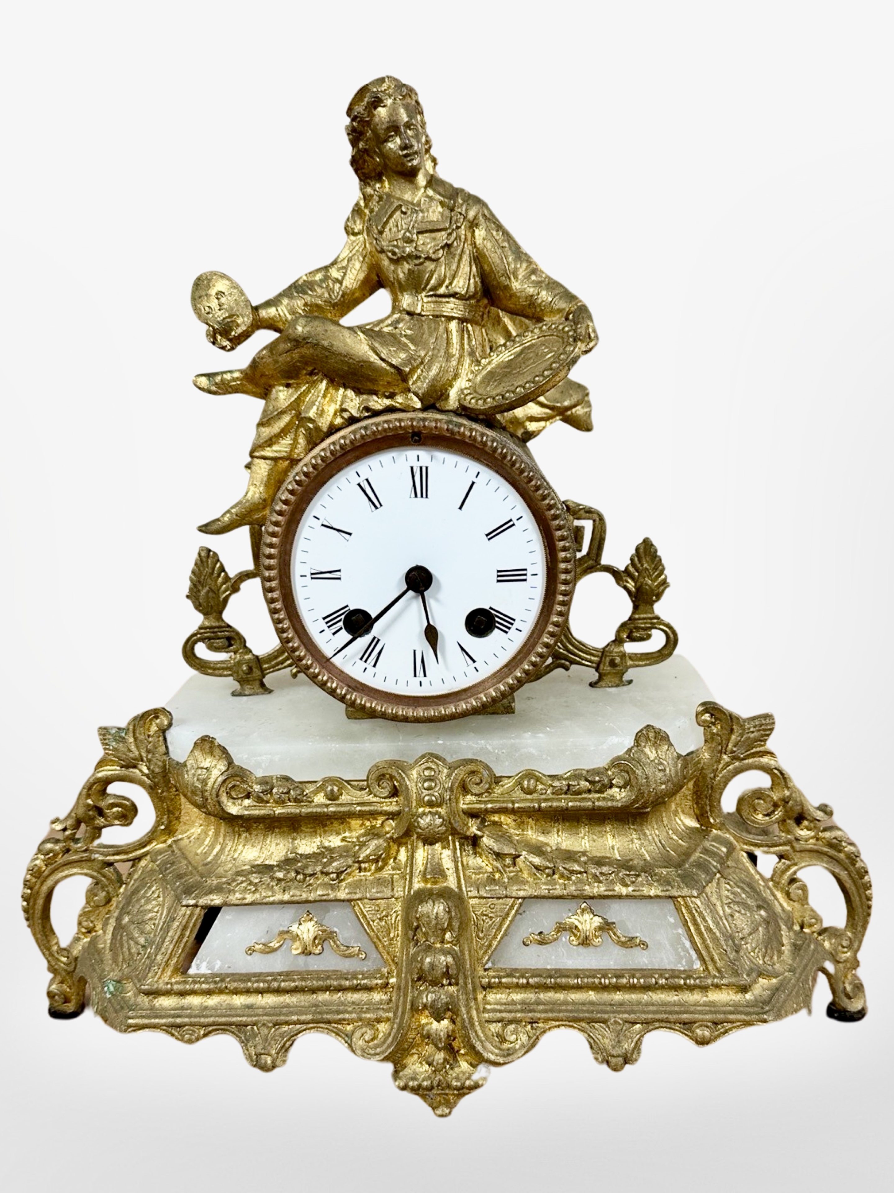 A 19th century French alabaster and gilt metal figural mantel clock, striking on a bell,