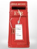 A reproduction painted metal postbox, height 60cm.