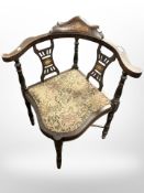 A Victorian inlaid rosewood corner armchair with tapestry seat