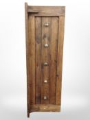 A stained pine coat rack,
