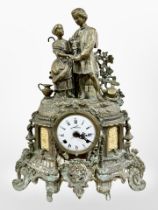 A 19th century patinated metal figural eight day mantel clock, striking on a bell, with key,