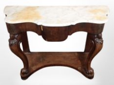 A Victorian carved mahogany serpentine front console table with white marble top,