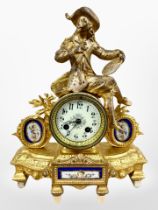 A 19th century French gilt metal and enamelled porcelain figural mantel clock,
