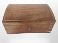 A hardwood and brass-inlaid dome-top jewellery box with key, width 30cm.