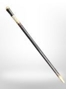 A sword stick in brass and bone-mounted wooden sheath, length 59cm.