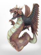 A painted and gilt dragon ornament,