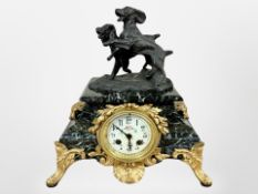 A 19th century green marble and gilt metal eight day mantel clock, later surmounted by two dogs,