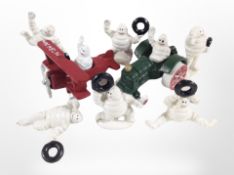 A group of cast-iron Michelin Man figures.