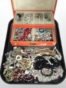 A contemporary jewellery box and contents including assorted bead necklaces and bangles, earrings.