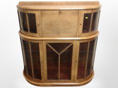 An Art Deco walnut bow-front display cabinet,