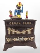 A novelty cast-iron organ money bank, height 19cm.