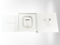 A pair of Apple AirPods model A2032, in box with instructions,
