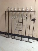 A painted wrought metal "NUFC" gate,
