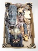 A box of ethnographic carvings, masks,