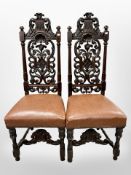 A pair of 19th century Dutch carved oak hall chairs