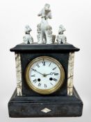 A 19th century marble and slate eight day mantel clock, with three later ceramic dogs above,