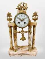 A 19th century French peach marble and gilt metal portico mantel clock, striking on a bell,