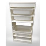 An Ikea chest fitted with pull out trays,