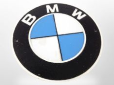 A cast-iron BMW plaque, diameter 24cm.