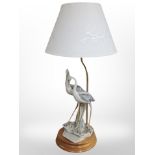 A Florence bisque porcelain table lamp modelled as two herons,