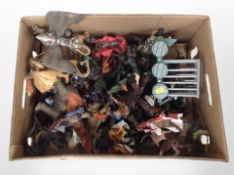 A box of plastic fantasy figurines.
