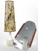 A teak framed mirror and a table lamp with conical shade