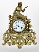 A 19th century French gilt metal figural mantel clock, movement lacking bell, with pendulum and key,