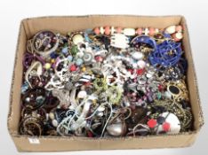 A large box of assorted costume jewellery including bead necklaces, bangles, etc.