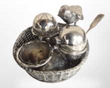 A Mappin & Webb silver-plated cruet set in the form of a chick perched over a basket of eggs,