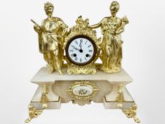 A 19th century French alabaster and gilt metal figural mantel clock, striking on a bell,