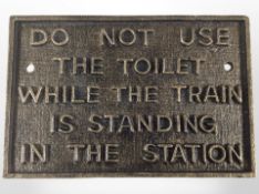 A cast-iron train notice plaque, width 29cm.