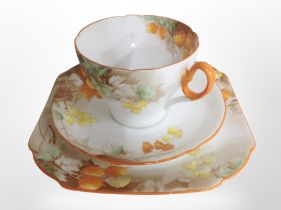 A Shelley Winter Cherry teacup, saucer and side plate.